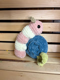crochet caterpillar on a blueberry plush